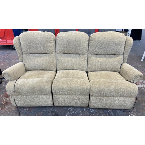 235 - A modern fabric upholstered electric reclining three seater sofa