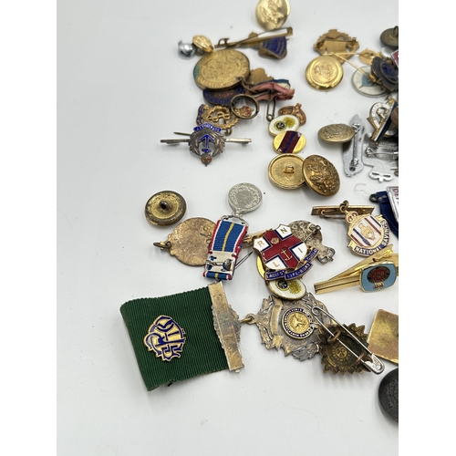 2226 - A collection of items to include two WVS Civil Defence badges, USSR badge, ROAB hallmarked sterling ... 