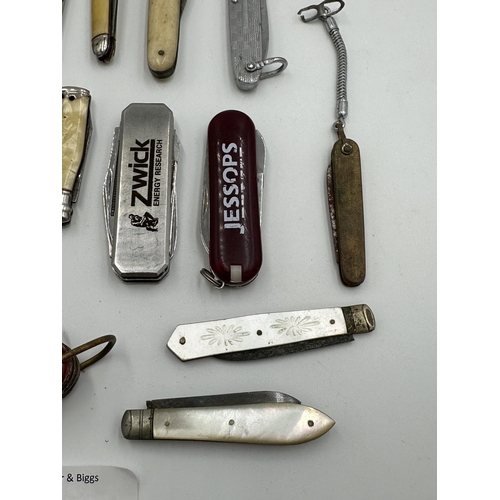 2228 - A collection of pocket knives to include Swiss army, hallmarked Sheffield silver and mother of pearl... 