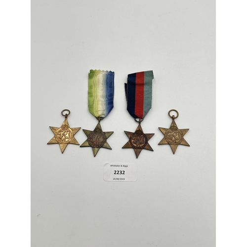 2232 - Four WWII medals, The Atlantic Star, The 1939-1945 Star, The Burma Star and The Pacific Star