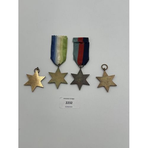 2232 - Four WWII medals, The Atlantic Star, The 1939-1945 Star, The Burma Star and The Pacific Star