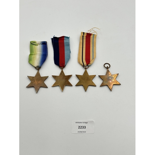 2233 - Four WWII medals, The Atlantic Star, The 1939-1945 Star, The Burma Star and The Pacific Star