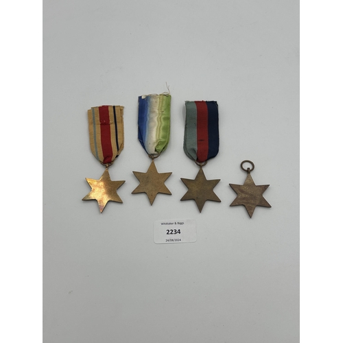 2234 - Four WWII medals, The Atlantic Star, The 1939-1945 Star, The Burma Star and The Pacific Star