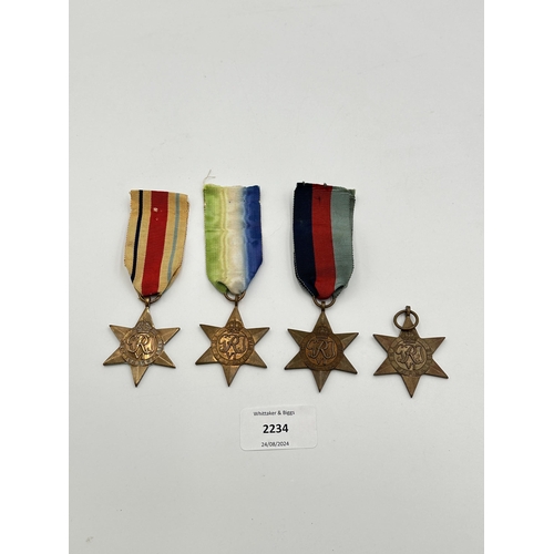 2234 - Four WWII medals, The Atlantic Star, The 1939-1945 Star, The Burma Star and The Pacific Star