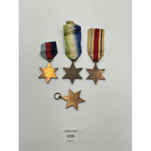 2235 - Four WWII medals, The Atlantic Star, The 1939-1945 Star, The Burma Star and The Pacific Star