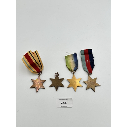 2236 - Four WWII medals, The Atlantic Star, The 1939-1945 Star, The Burma Star and The Pacific Star