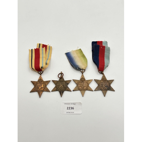 2236 - Four WWII medals, The Atlantic Star, The 1939-1945 Star, The Burma Star and The Pacific Star