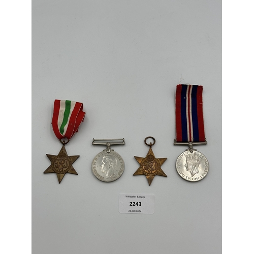 2243 - Four WWII medals, War, The Defence, The Italy Star and the 1939-1945 Star