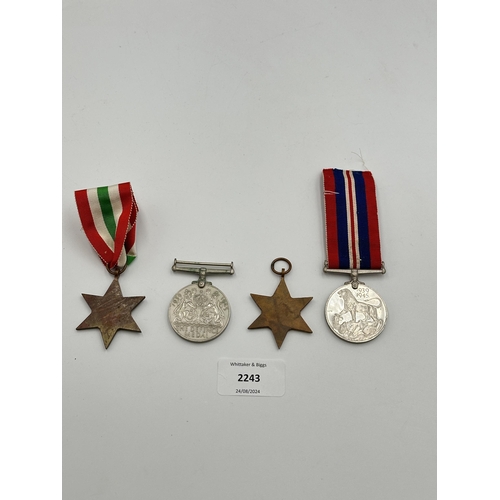 2243 - Four WWII medals, War, The Defence, The Italy Star and the 1939-1945 Star