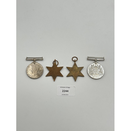 2244 - Four WWII medals, War, The Defence, The Italy Star and the 1939-1945 Star