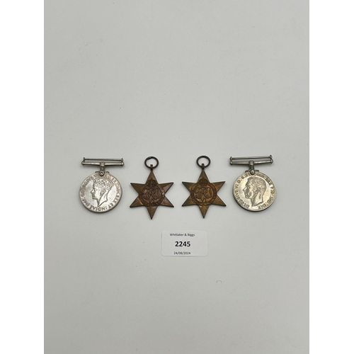 2245 - Four WWII medals, War, The Defence, The Italy Star and the 1939-1945 Star