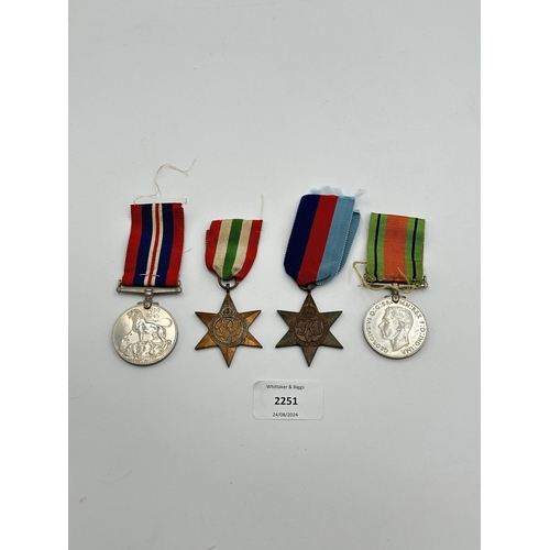 2251 - Four WWII medals, War, The Defence, The Italy Star and the 1939-1945 Star