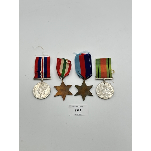 2251 - Four WWII medals, War, The Defence, The Italy Star and the 1939-1945 Star