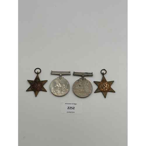 2252 - Four WWII medals, War, The Defence, The Italy Star and the 1939-1945 Star