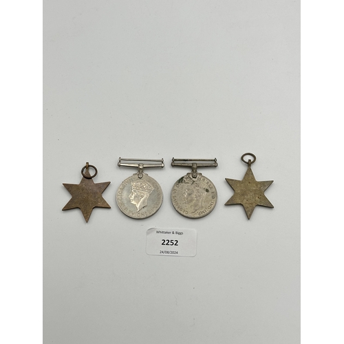 2252 - Four WWII medals, War, The Defence, The Italy Star and the 1939-1945 Star