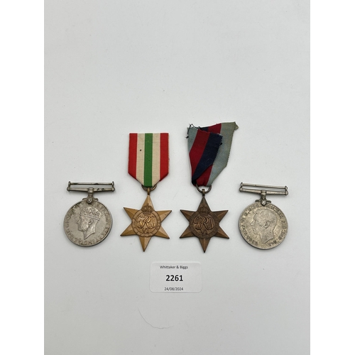 2261 - Four WWII medals, War, The Defence, The Italy Star and the 1939-1945 Star