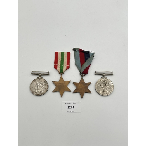 2261 - Four WWII medals, War, The Defence, The Italy Star and the 1939-1945 Star