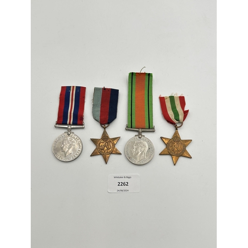 2262 - Four WWII medals, War, The Defence, The Italy Star and the 1939-1945 Star