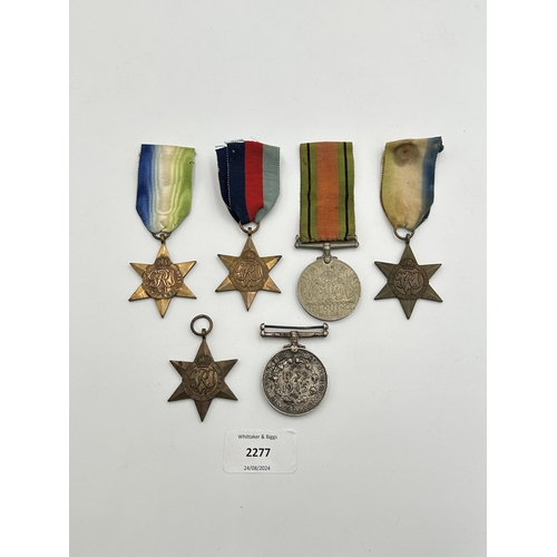 2277 - Six WWII medals, one The Defence, one The Burma Star, two The Atlantic Star, one The 1939-1945 Star ... 