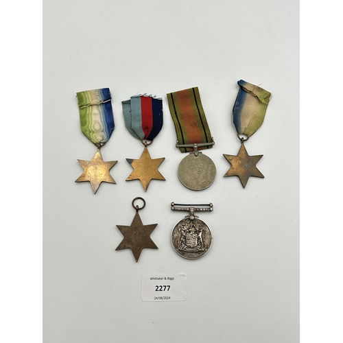 2277 - Six WWII medals, one The Defence, one The Burma Star, two The Atlantic Star, one The 1939-1945 Star ... 