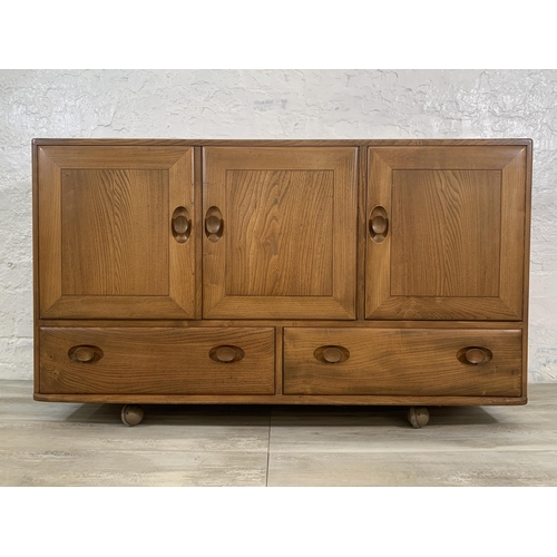 1 - An Ercol Windsor Model 468 blonde elm sideboard - approx. 77cm high x 129cm wide x 43cm deep