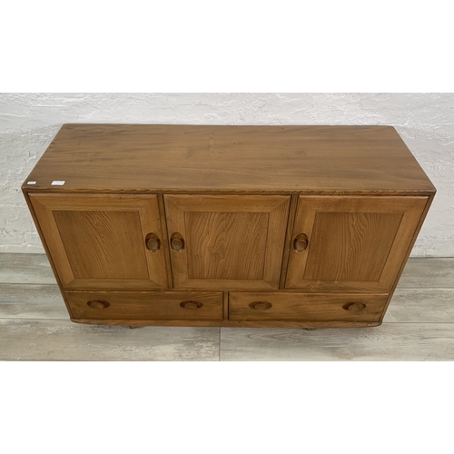 1 - An Ercol Windsor Model 468 blonde elm sideboard - approx. 77cm high x 129cm wide x 43cm deep