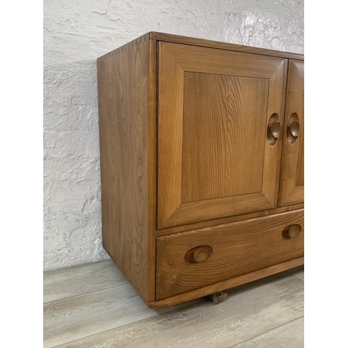 1 - An Ercol Windsor Model 468 blonde elm sideboard - approx. 77cm high x 129cm wide x 43cm deep