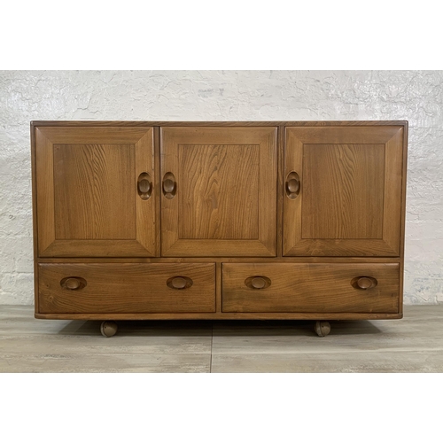 1 - An Ercol Windsor Model 468 blonde elm sideboard - approx. 77cm high x 129cm wide x 43cm deep