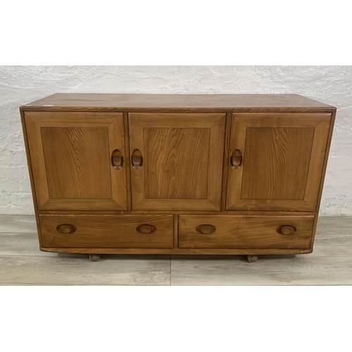 1 - An Ercol Windsor Model 468 blonde elm sideboard - approx. 77cm high x 129cm wide x 43cm deep