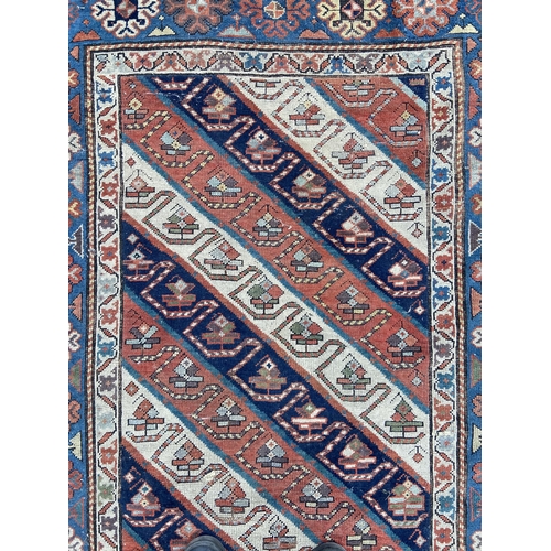 101 - A late 19th century Caucasian Genje rug - approx. 230cm x 125cm