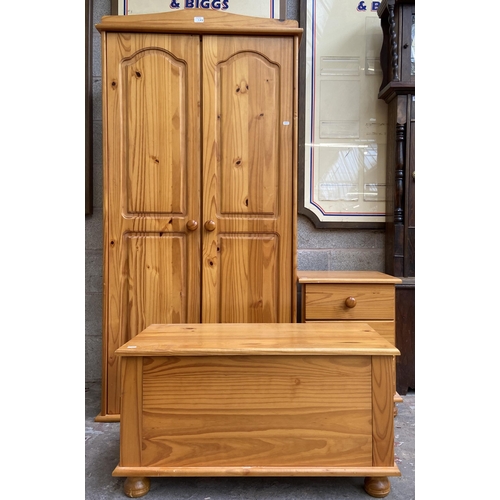 11 - Three pieces of pine bedroom furniture, double wardrobe approx. 173cm high x 86cm wide x 50cm deep, ... 