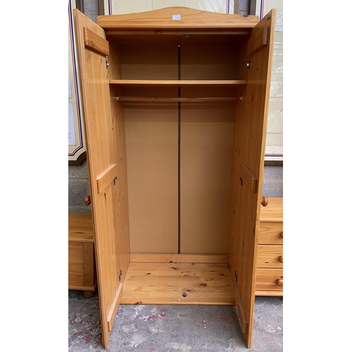 11 - Three pieces of pine bedroom furniture, double wardrobe approx. 173cm high x 86cm wide x 50cm deep, ... 