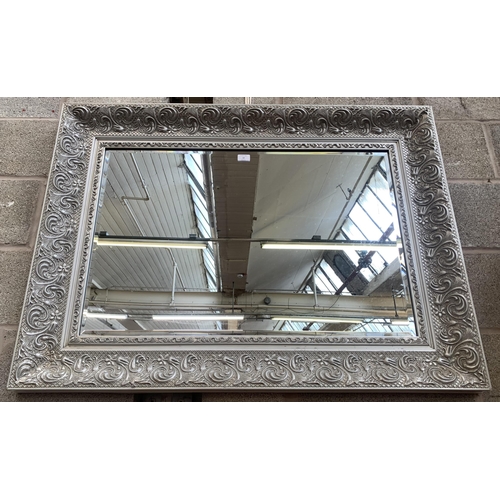 12 - A 19th century style silver painted framed bevelled edge wall mirror - approx. 87cm high x 115cm wid... 