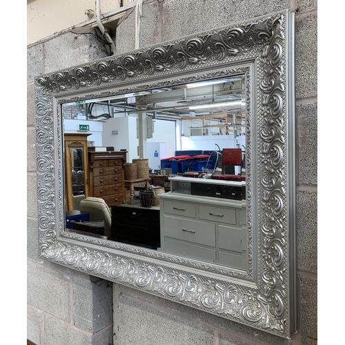 12 - A 19th century style silver painted framed bevelled edge wall mirror - approx. 87cm high x 115cm wid... 