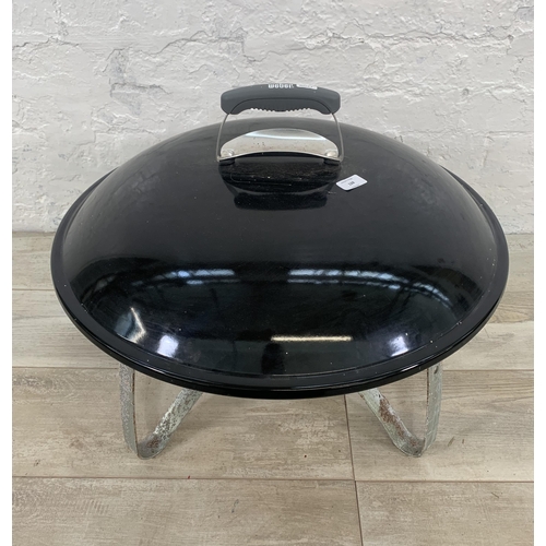 128 - A Weber outdoor wood burning fireplace - approx. 63cm diameter