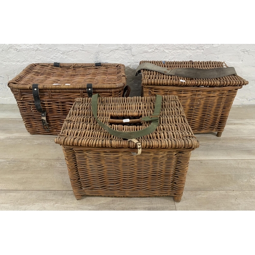 129 - Three wicker baskets, two vintage fishing and one twin handled