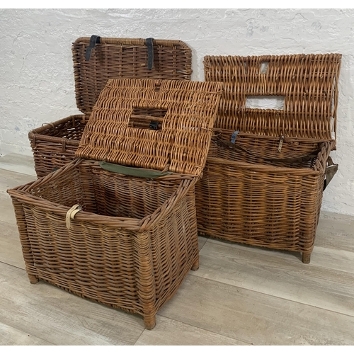 129 - Three wicker baskets, two vintage fishing and one twin handled