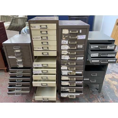 132 - Four metal filing cabinets - largest approx. 95cm high x 28cm wide x 41cm deep