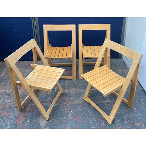 134 - Four beech folding chairs