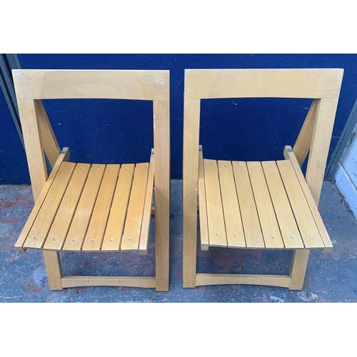 134 - Four beech folding chairs