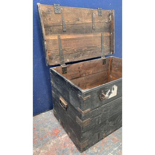 135 - Two items, one glass demijohn - approx. 36cm high and one early 20th century ebonised pine toolbox -... 