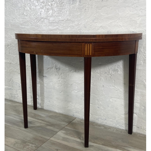 184 - A George III inlaid mahogany demi lune fold over card table - approx. 73cm high x 99cm wide x 46cm d... 