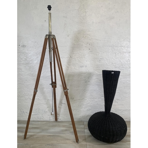 19 - Two items, one teak and chrome plated tripod floor lamp - approx. 178cm high and one wicker floor st... 