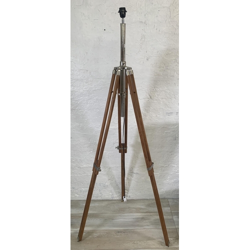 19 - Two items, one teak and chrome plated tripod floor lamp - approx. 178cm high and one wicker floor st... 