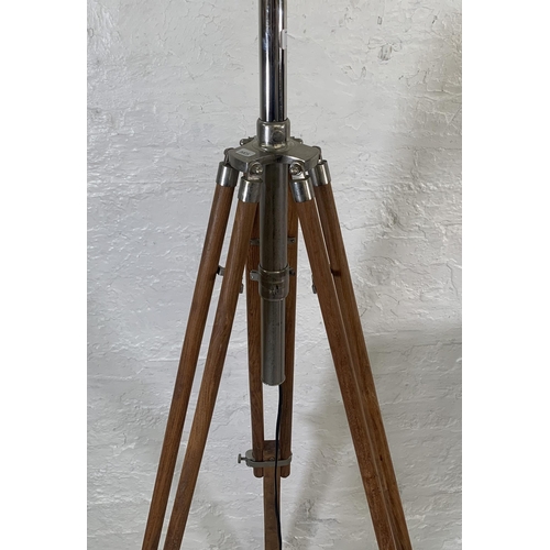 19 - Two items, one teak and chrome plated tripod floor lamp - approx. 178cm high and one wicker floor st... 