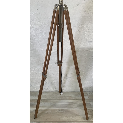 19 - Two items, one teak and chrome plated tripod floor lamp - approx. 178cm high and one wicker floor st... 