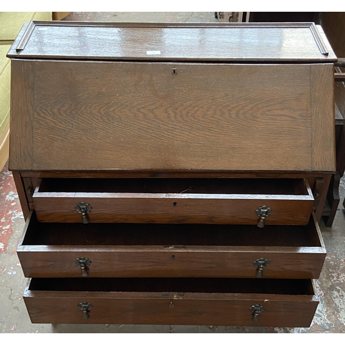 199 - A 1930s oak bureau - approx. 96cm high x 90cm wide x 42cm deep