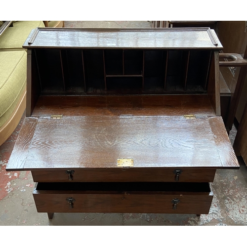 199 - A 1930s oak bureau - approx. 96cm high x 90cm wide x 42cm deep