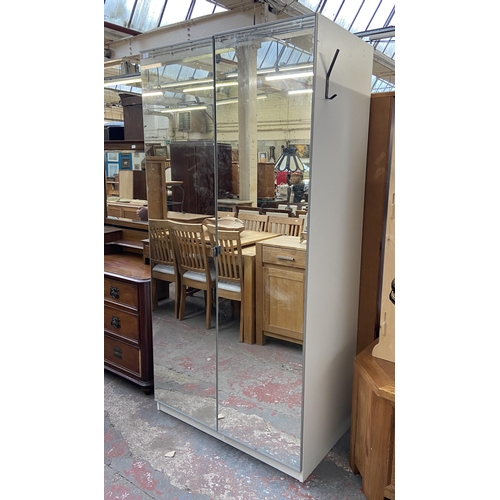 202 - An IKEA white laminate and mirror glass double wardrobe - approx. 201cm high x 100cm wide x 60cm dee... 