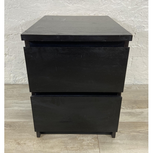 75 - An IKEA black laminate bedside chest of drawers - approx. 55cm high x 40cm wide x 49cm deep